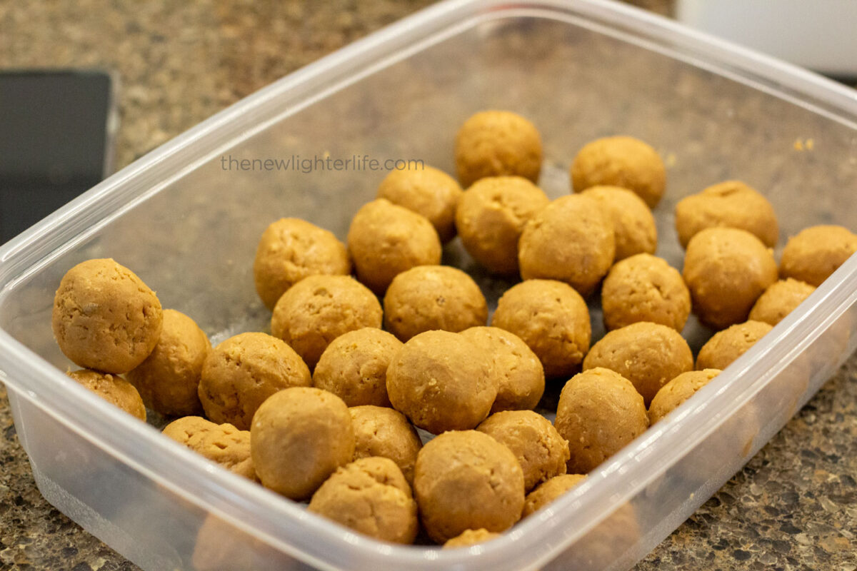 Stored peanut butter balls with rice krispies for dipping